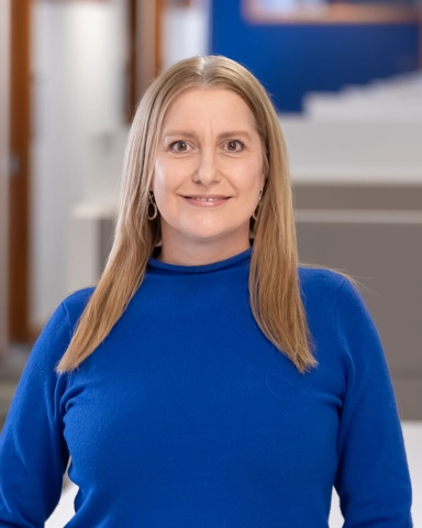 smiling person in professional attire